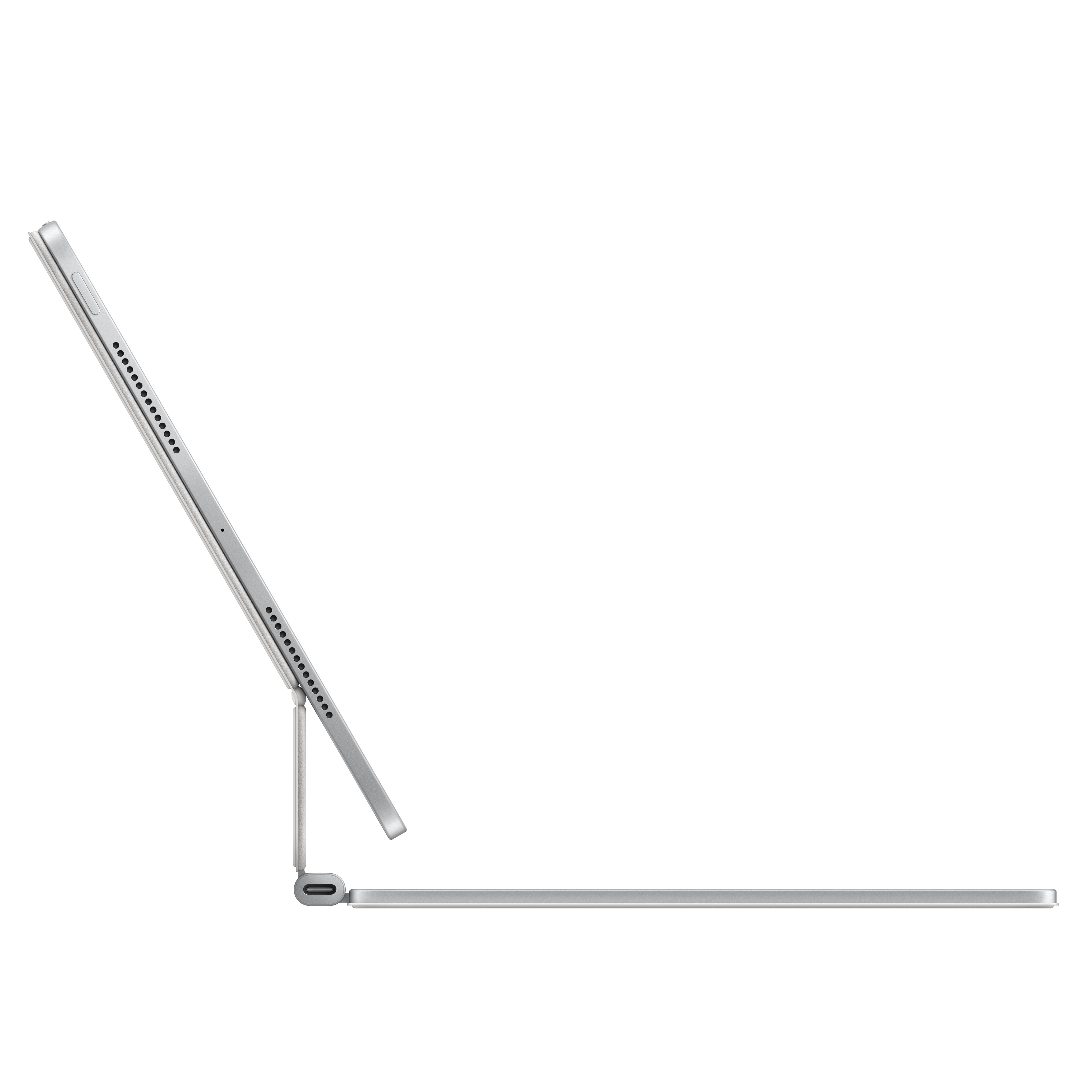 Tablet d'argento su supporto per tastiera, aperto. Vista laterale con porta USB-C.
