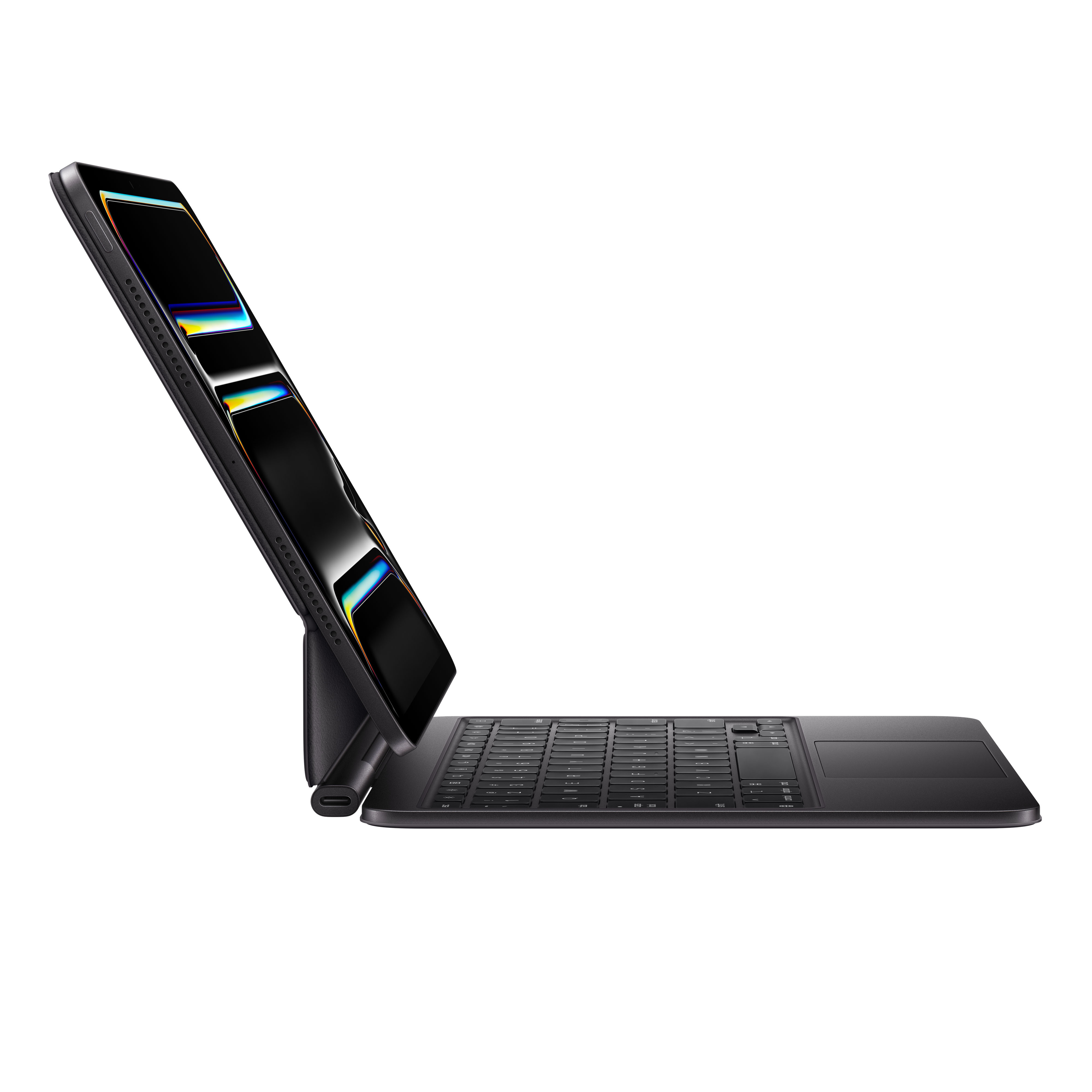 Un tablet nero è appoggiato con una tastiera nera. Lo schermo mostra un'immagine colorata.