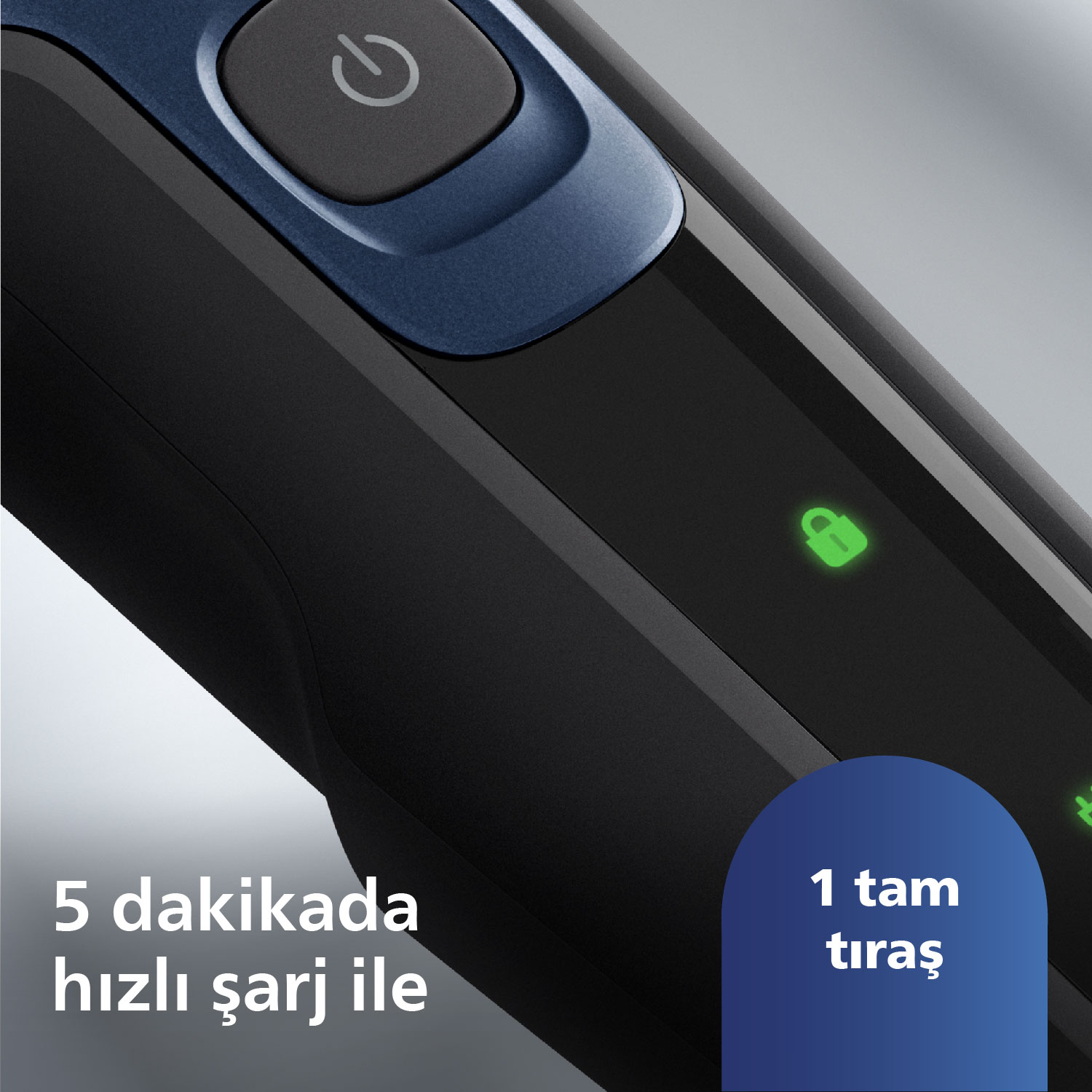 Yeşil kilit sembolü olan siyah ve mavi bir elektrikli tıraş makinesinin yakın çekimi. Metin: 5 dakika hızlı şarj.
