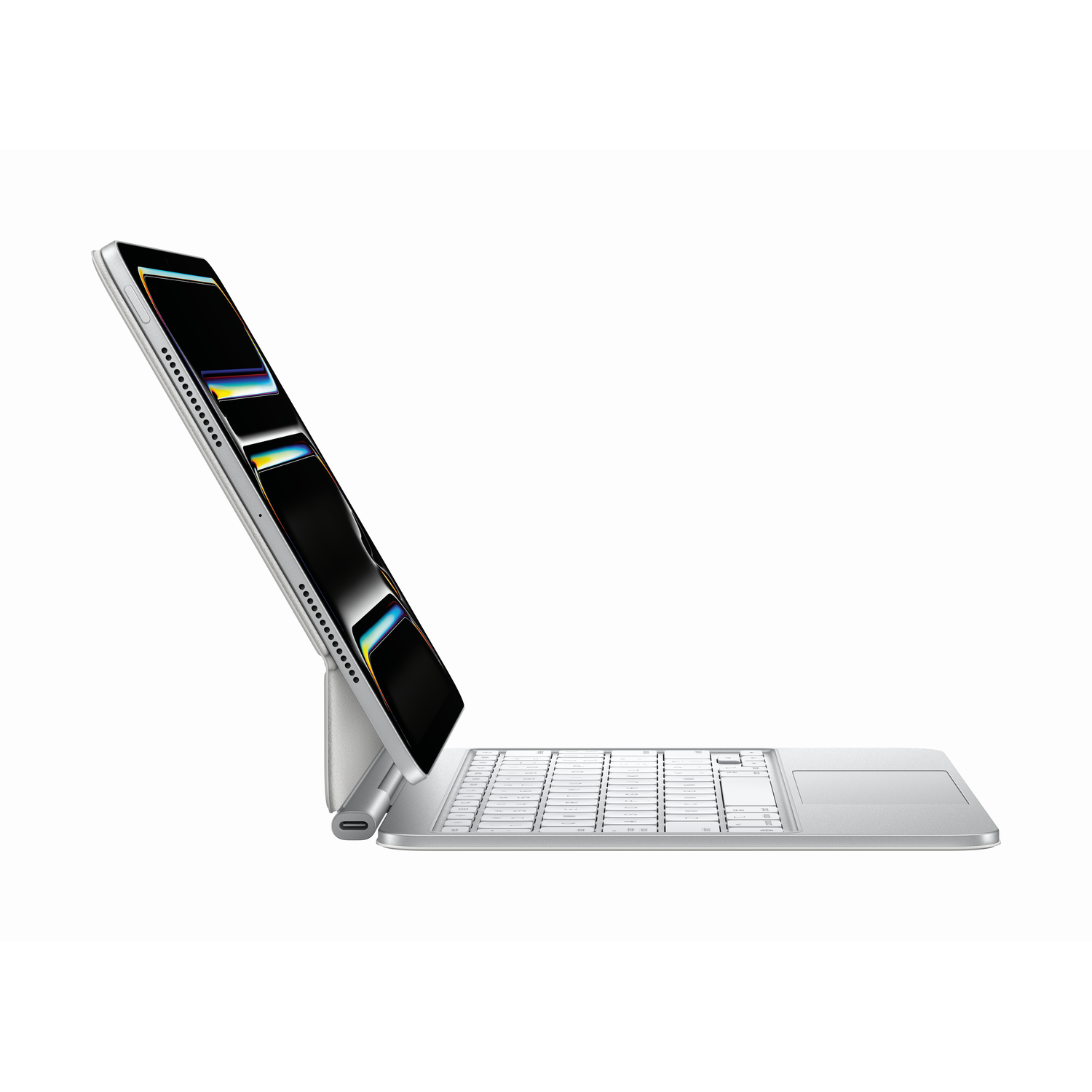 An iPad on a keyboard. The screen shows the iPad display. Text: Magic Keyboard.