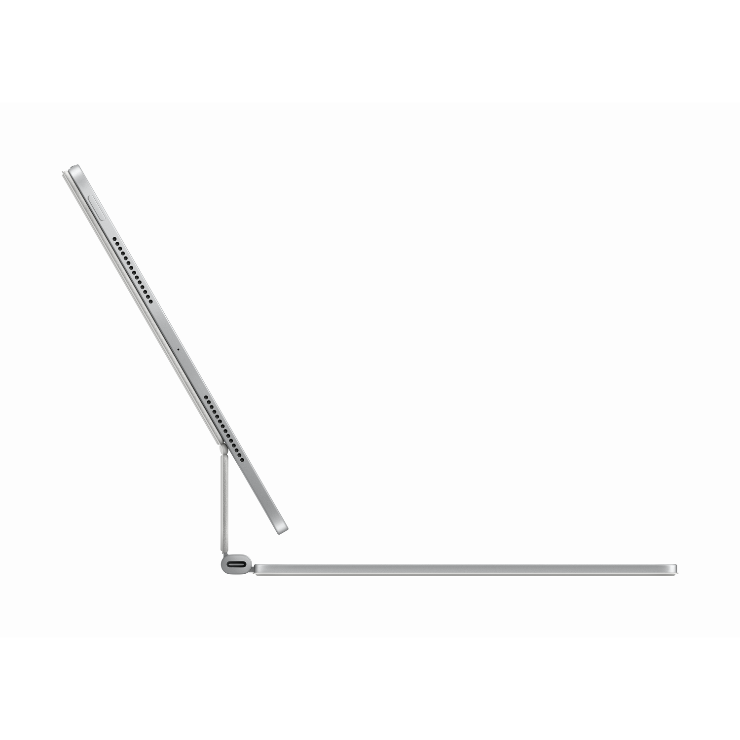 A silver iPad is on a table with its keyboard. It is angled upwards.