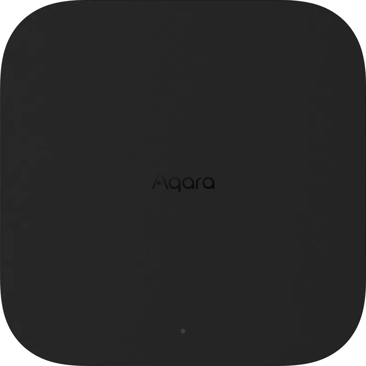 Un hub domestique intelligent Aqara noir avec le logo Aqara. Le fond est blanc.