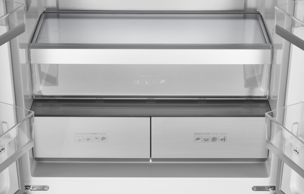 Inside a refrigerator: glass shelves, drawers labeled 'Moist Zone' and 'Zero Star Zone'.