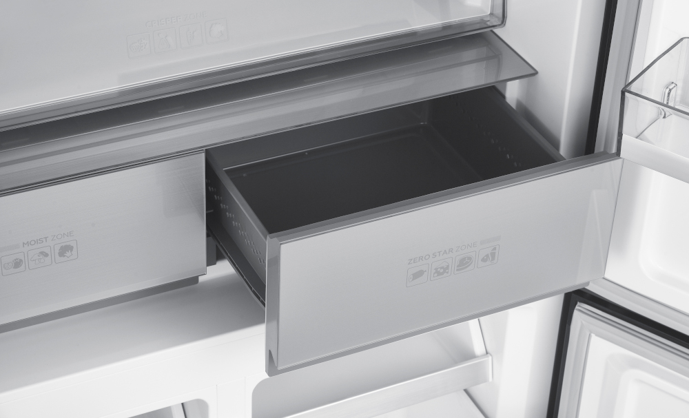 Open refrigerator with an empty drawer labeled "ZERO STAR ZONE" and other zones.