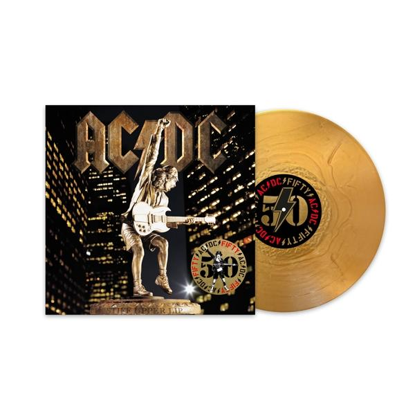 Albumcover: Eine goldene Vinylplatte neben ihrem Cover. Statue eines Gitarre spielenden Mannes. Text: AC/DC.