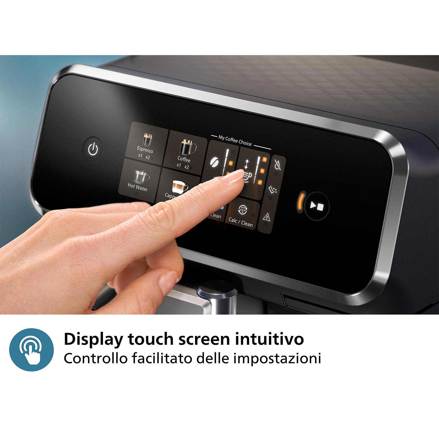 Un dito che tocca un touchscreen su una macchina da caffè nera, con testo sottostante.