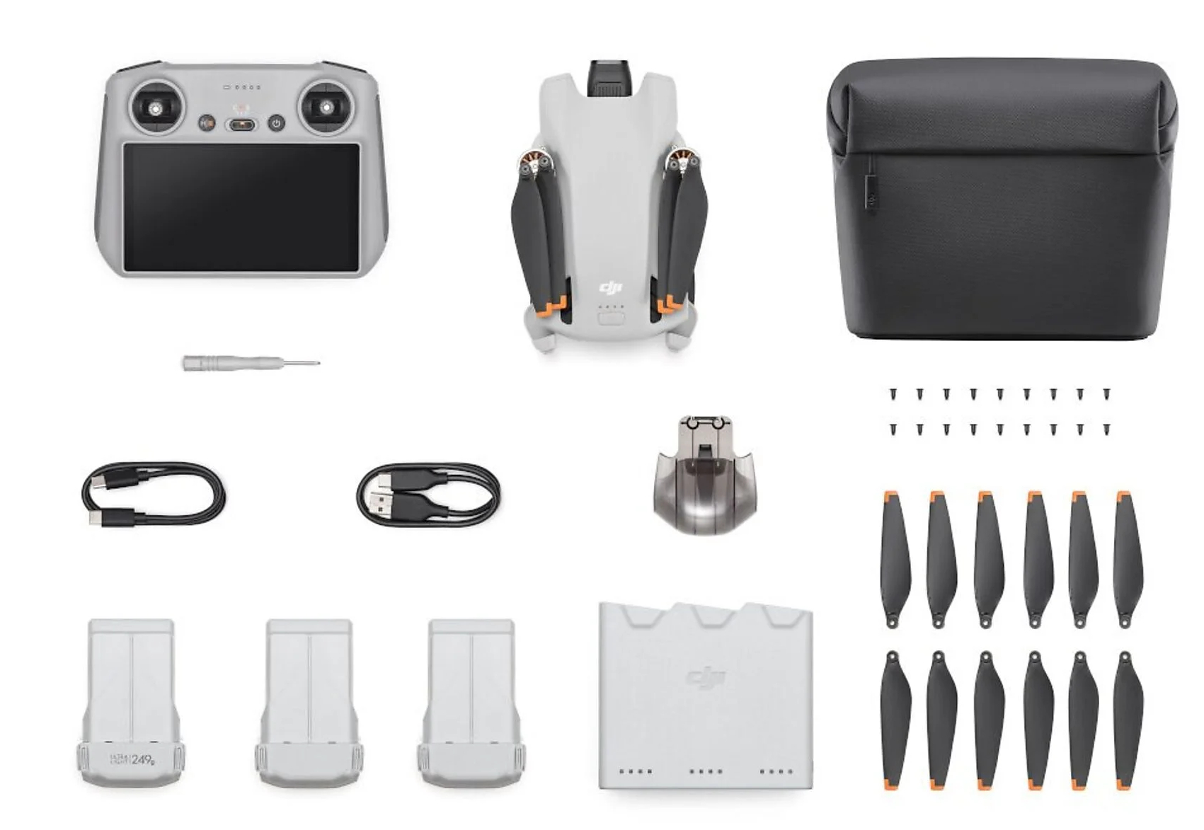 Dron i akcesoria: pilot, baterie, ładowarka, śmigła itp.