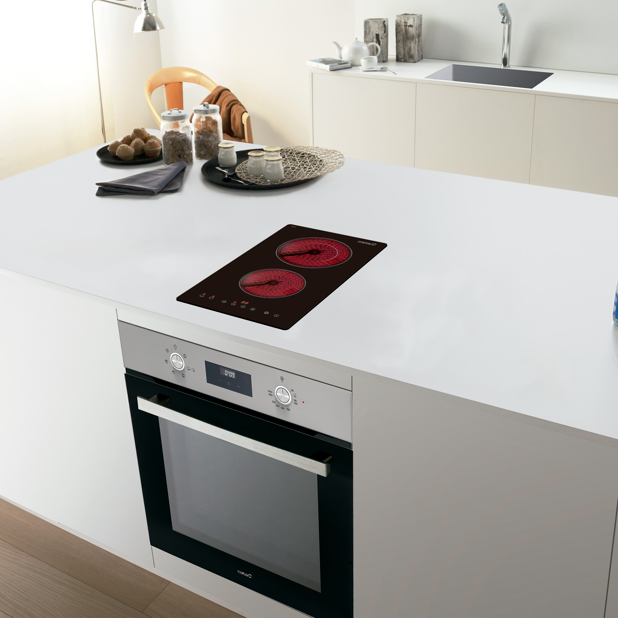 Isla de cocina con quemadores rojos y horno.
