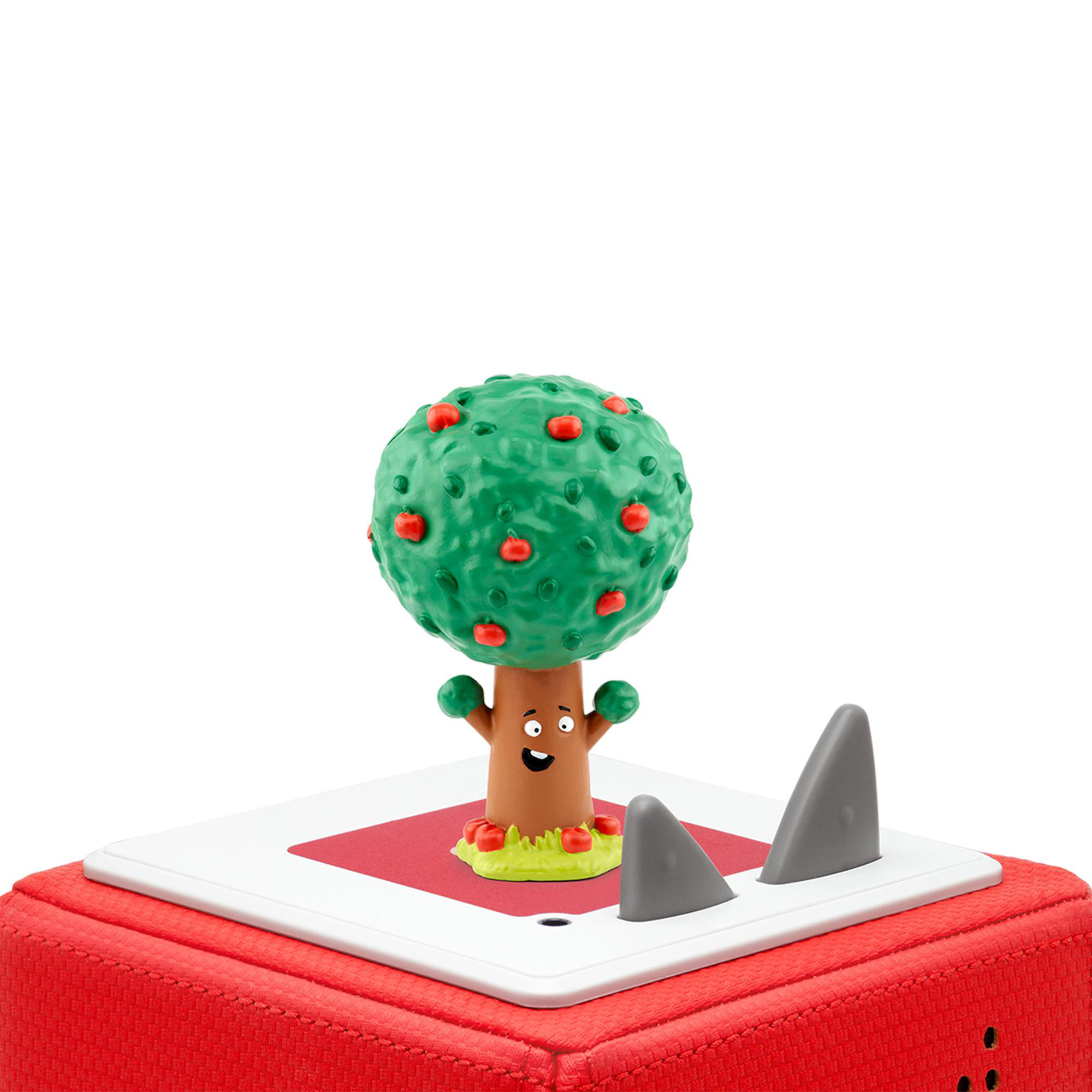 Spielzeugbaum mit Äpfeln auf einer roten Box mit Haifischflossen. Weißer Hintergrund.