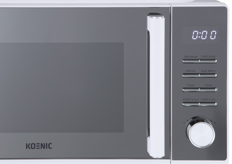 Zbliżenie białej kuchenki mikrofalowej z panelem sterowania i uchwytem.