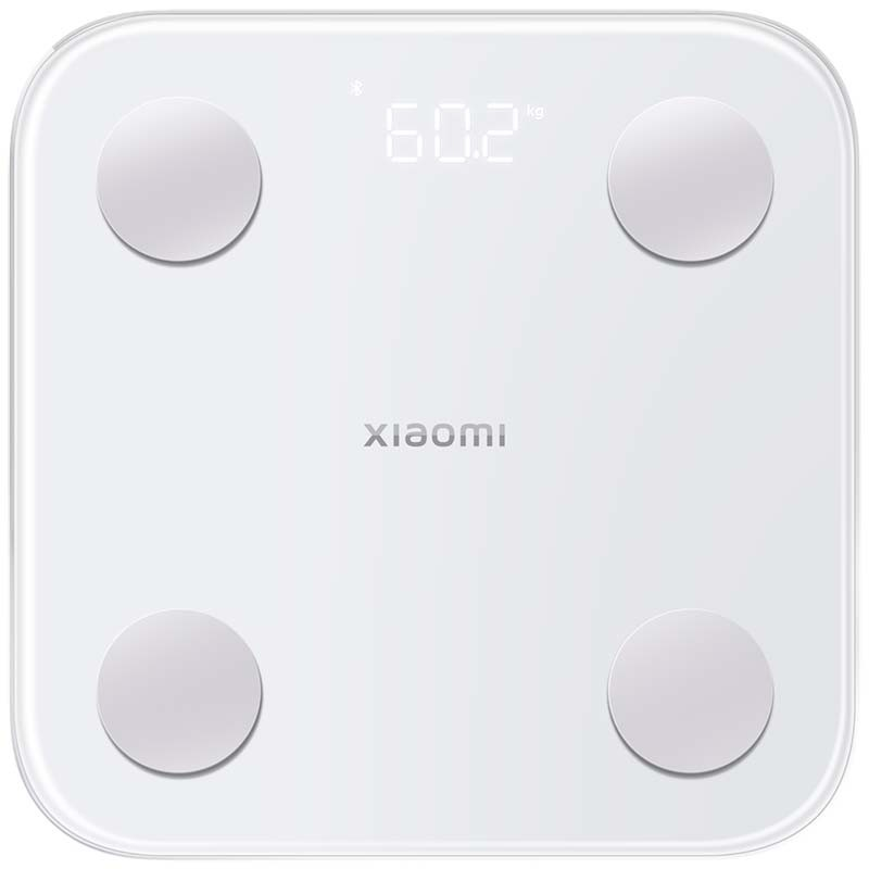 Báscula digital blanca con cuatro almohadillas circulares y el logotipo de Xiaomi; muestra un peso de 60,2 kg.