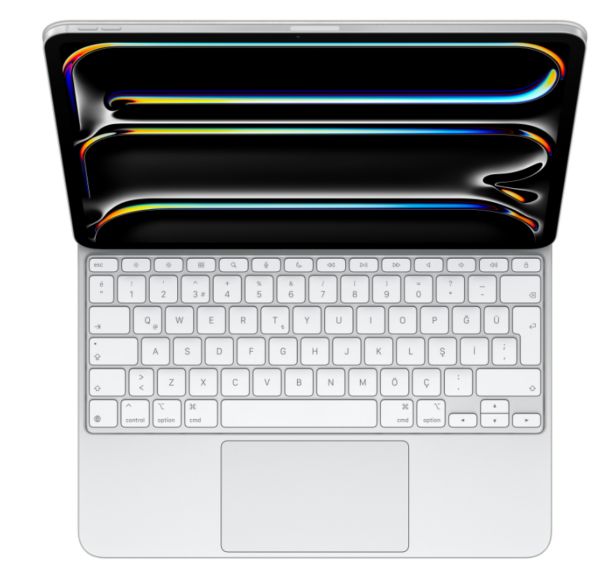 Klavye eklentisi olan açık bir iPad. Ekran renkli, soyut bir görüntü gösteriyor.