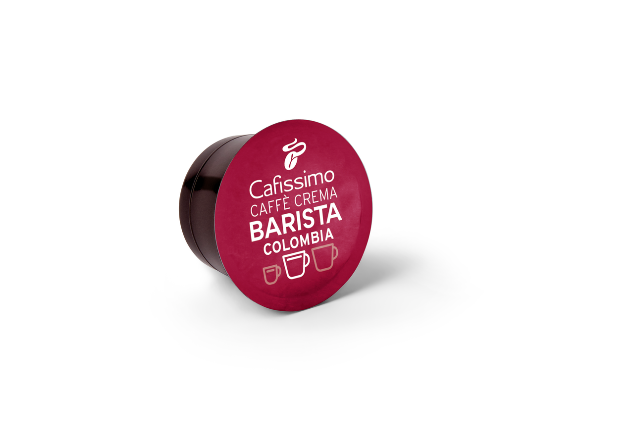 Pojedyncza, kasztanowa kapsułka do kawy na białej powierzchni.