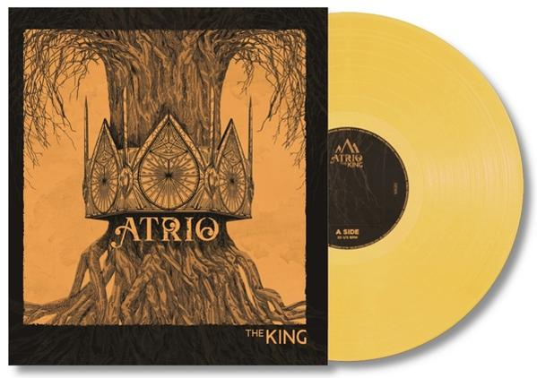 Vinyl-Cover von Atrio, The King. Eine Krone über einem Baum ist auf dem Cover. Die Schallplatte ist gelb.