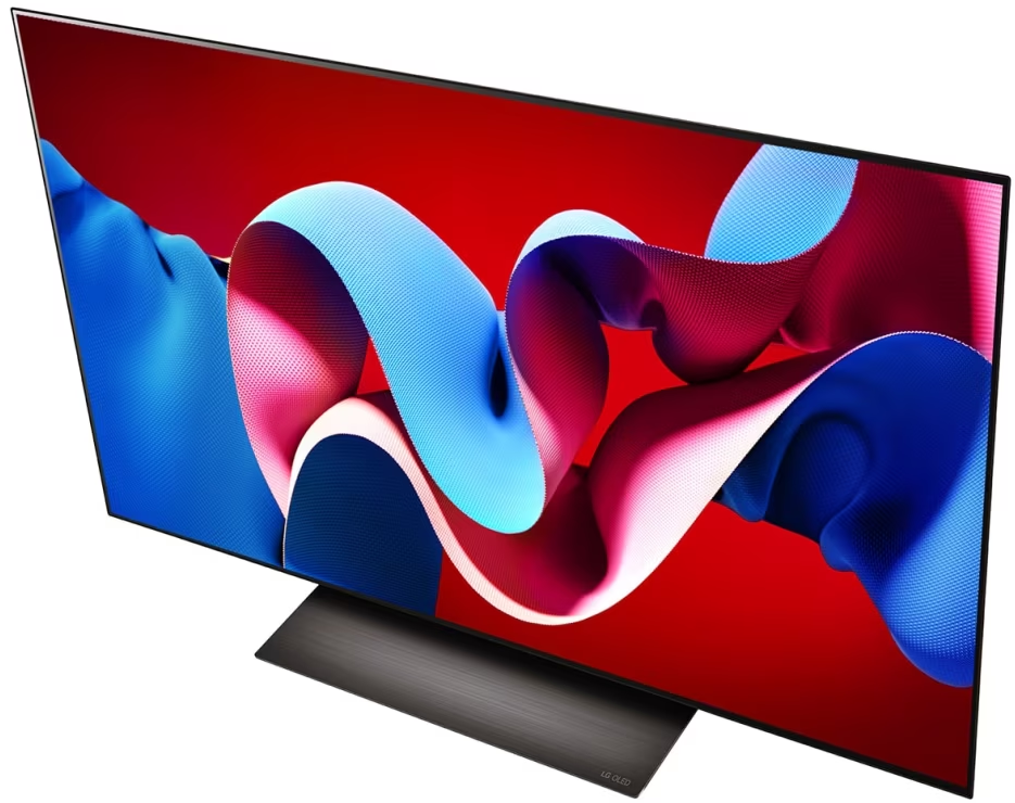 Telewizor z czerwonym tłem i wirującym abstrakcyjnym wzorem na ekranie.
