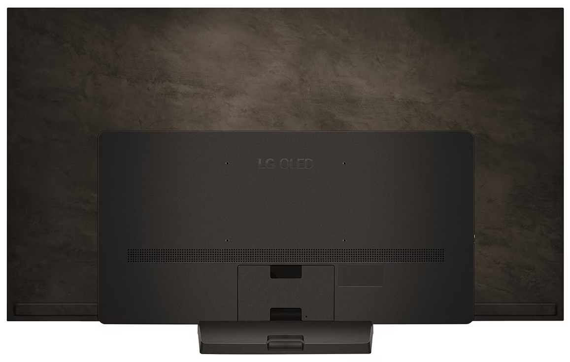 Tył czarnego telewizora LG OLED na ciemnobrązowej teksturowanej ścianie.