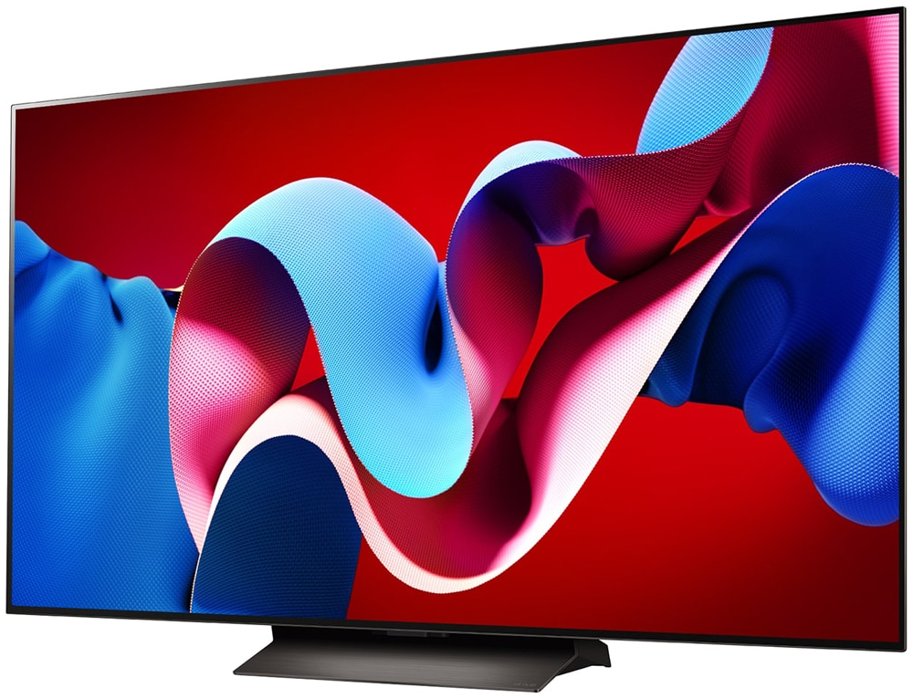 Duży ekran telewizora wyświetlający kolorowy abstrakcyjny wzór na czerwonym tle.