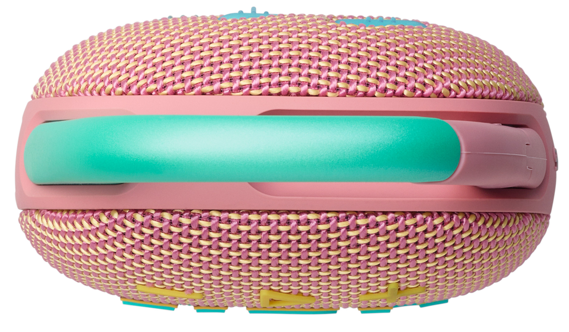 Mały, różowy głośnik z zielonym uchwytem i żółtymi akcentami, widok z boku.