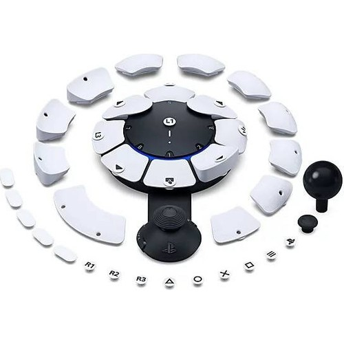 Etrafında birden fazla çıkarılabilir beyaz parça bulunan beyaz ve siyah bir Playstation kontrolcüsü.