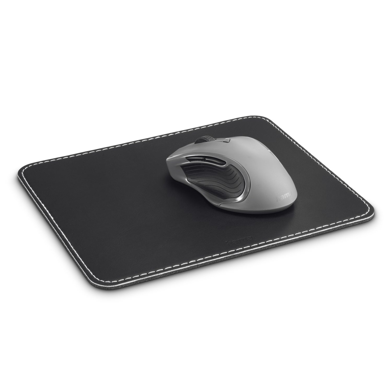 A gray computer mouse rests on a black mousepad with white stitching around the edge.