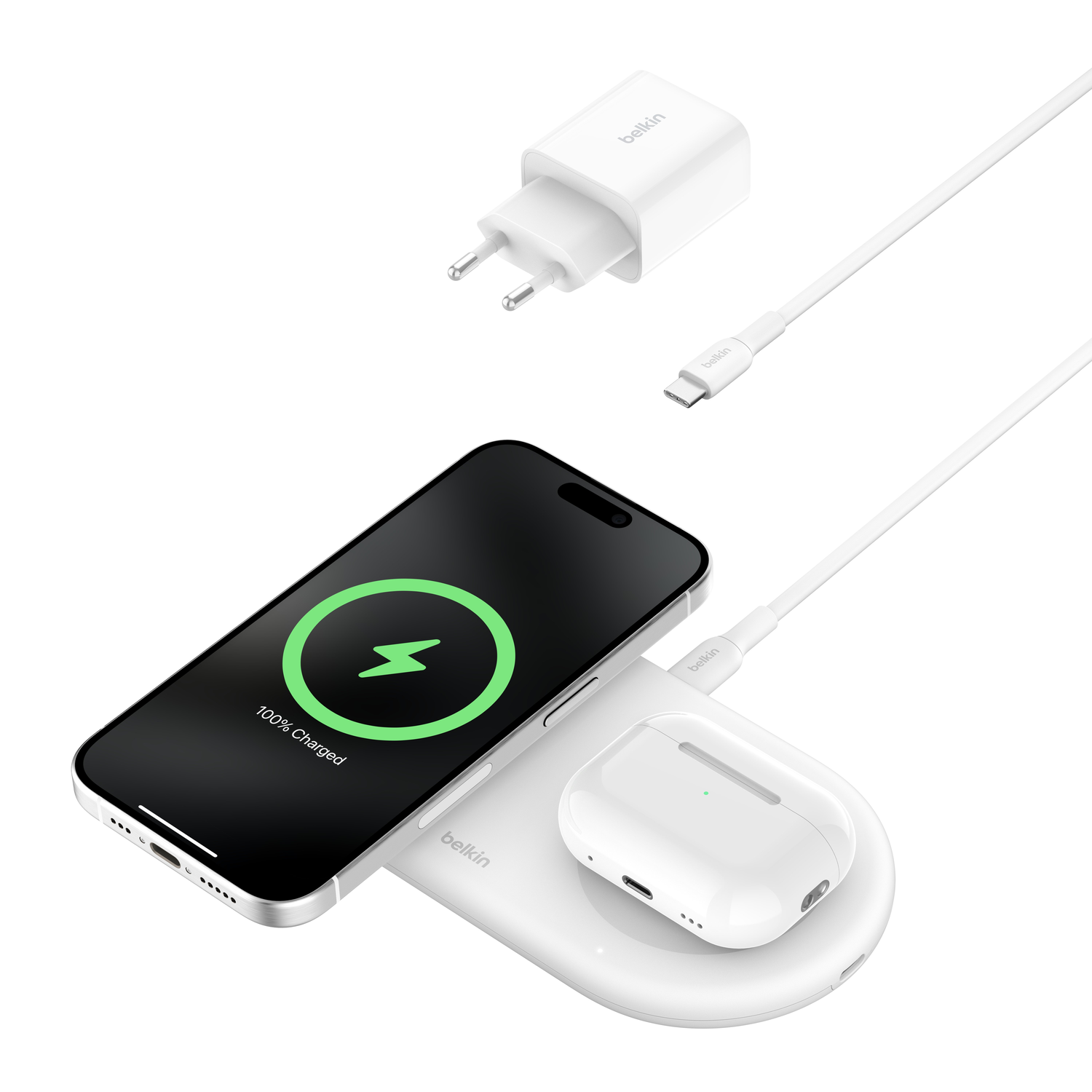White charging pad, phone, and earbuds charging. Isolated on white.