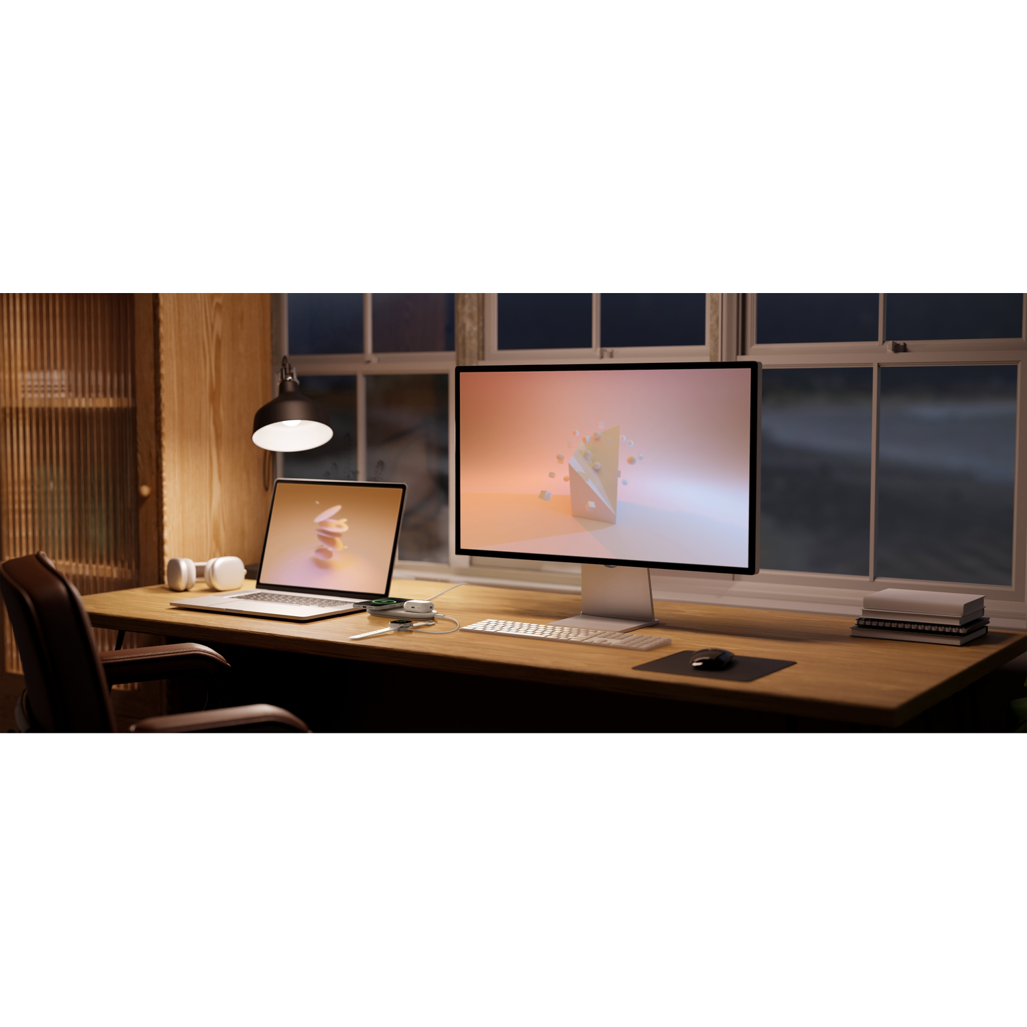 A well-lit home office with a desk holding a laptop, monitor, headphones, and a lamp.
