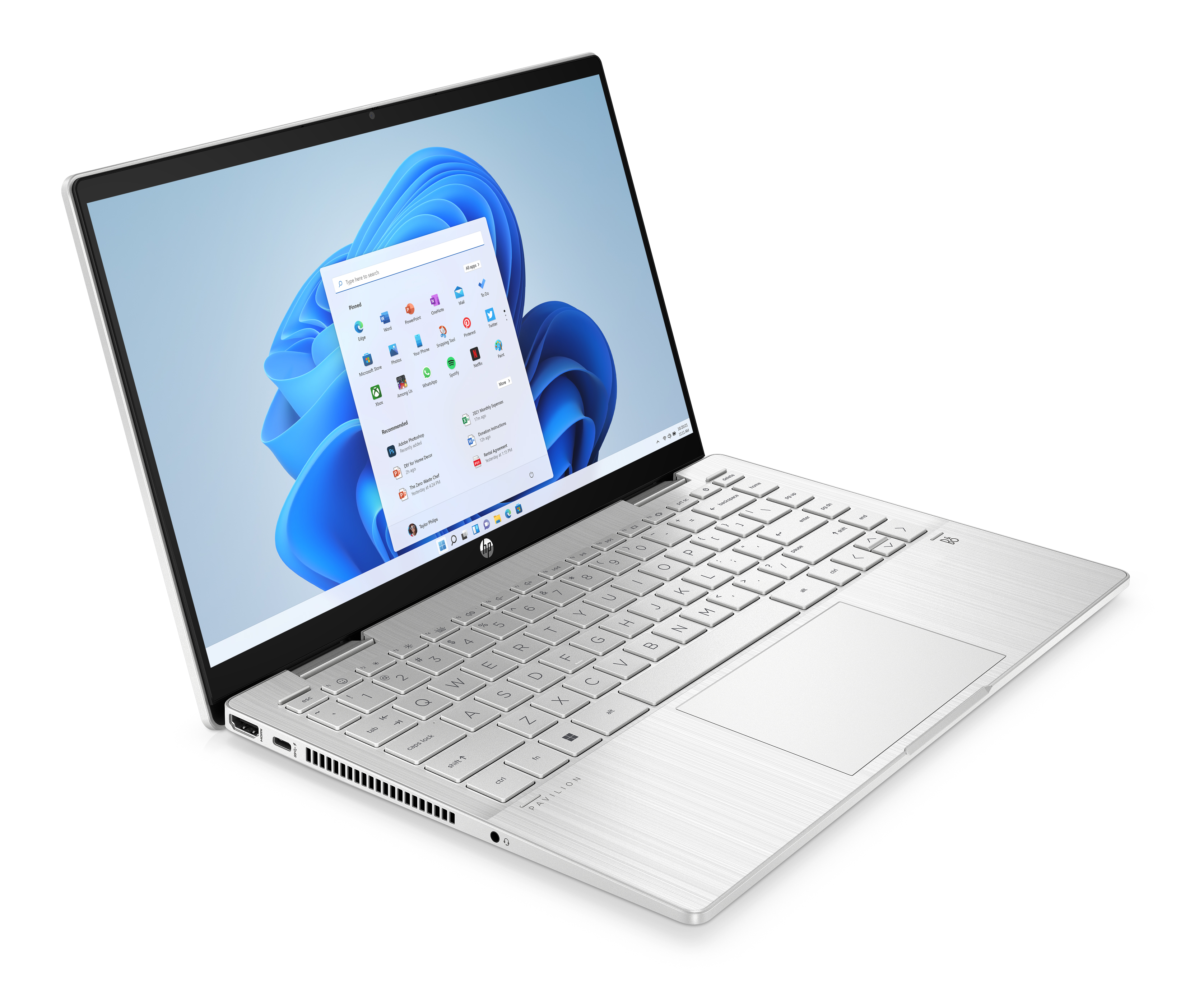 Beyaz bir dizüstü bilgisayar masada. Ekran Windows 11 arayüzünü gösteriyor. Klavye görünür.