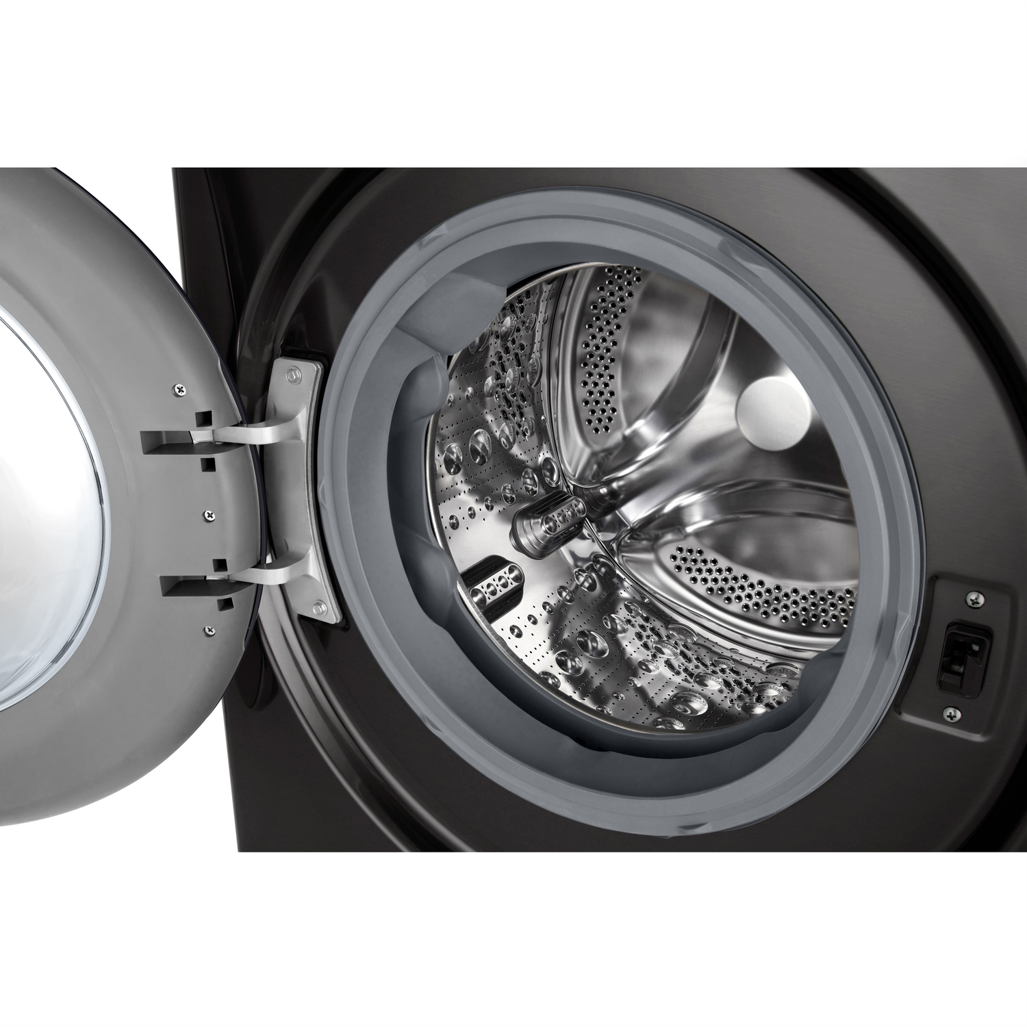 Open black washing machine door with stainless steel drum visible inside.