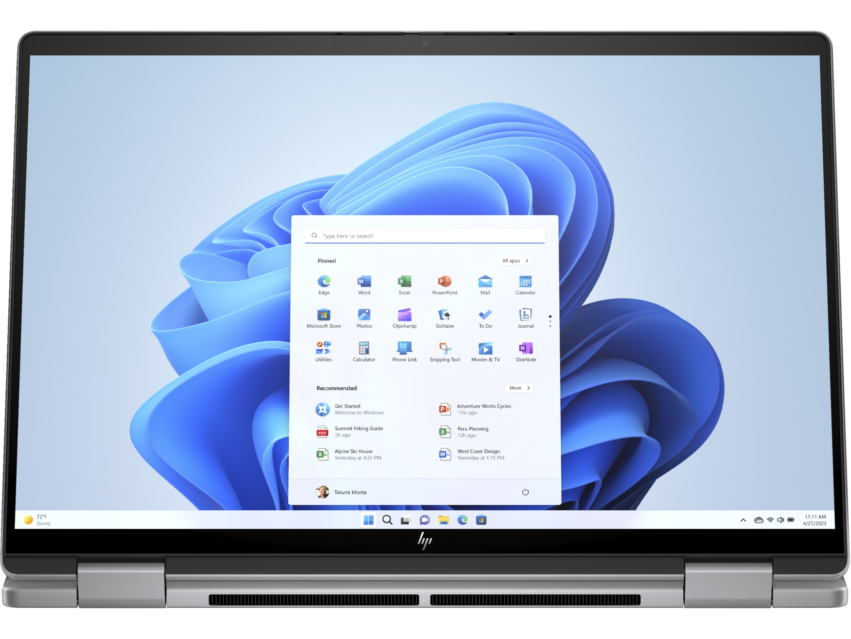 Ordenador portátil con la interfaz de Windows 11 abierta. Se muestran iconos y ajustes.