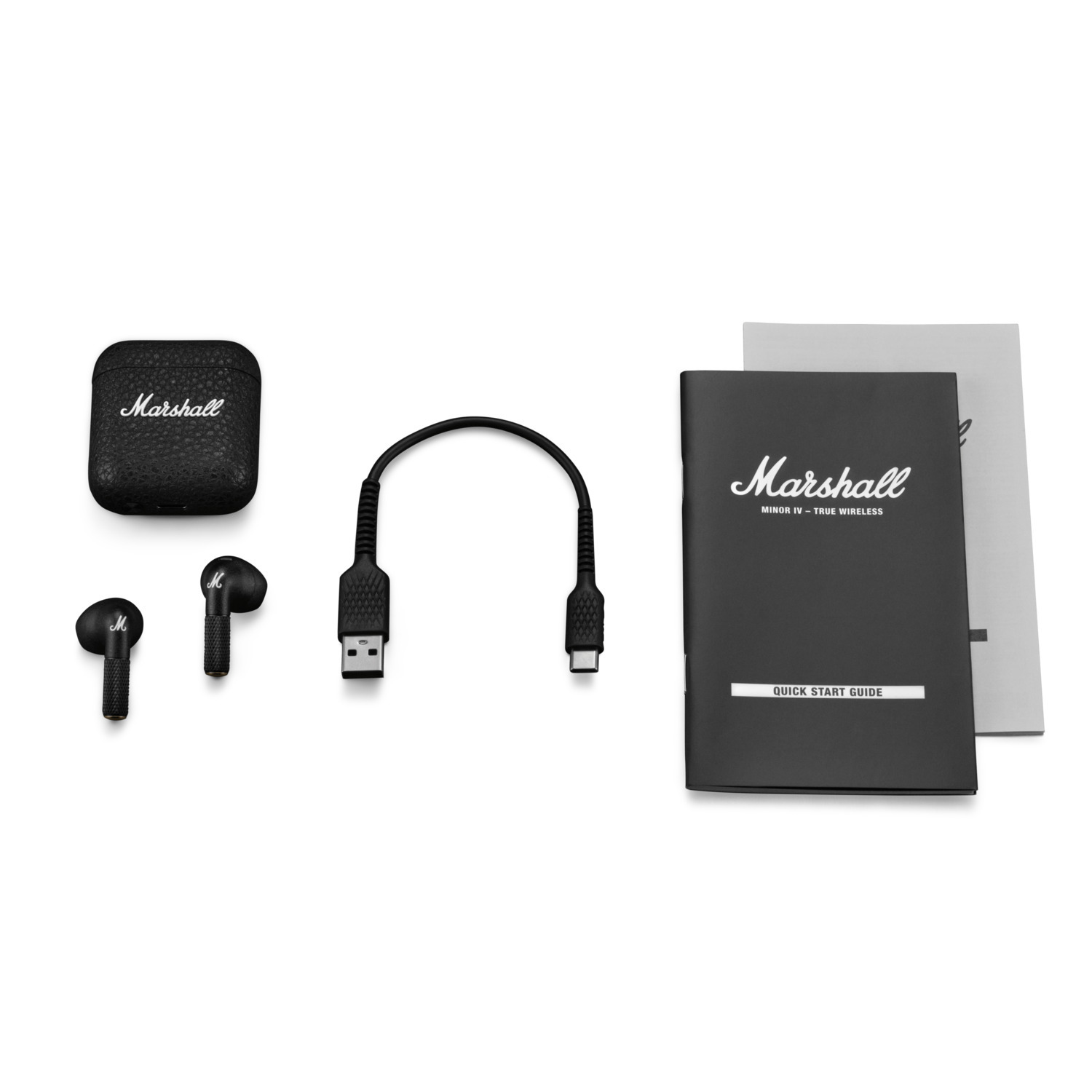Écouteurs sans fil Marshall Minor IV, étui de charge, câble USB et guide.