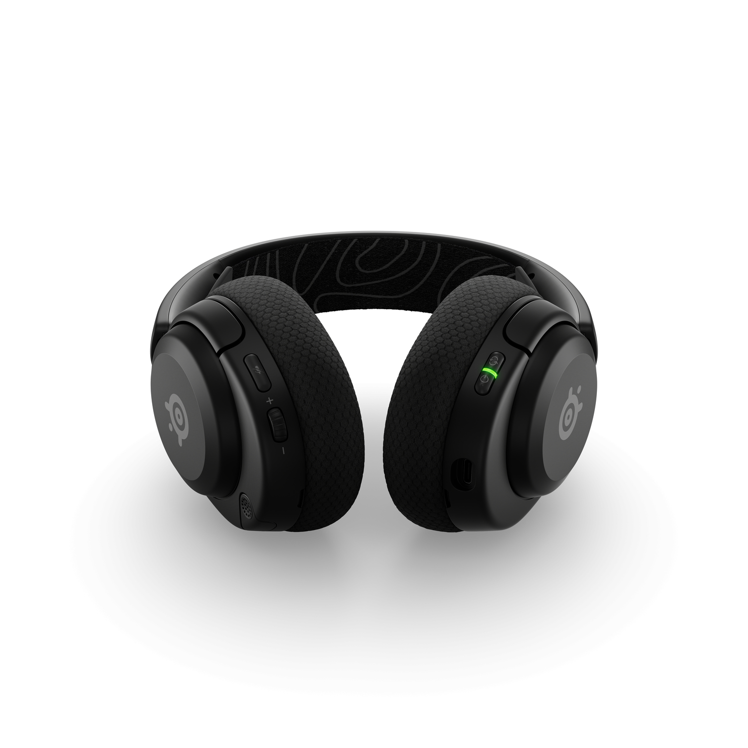 Vue de dessus d'un casque de jeu noir. Le casque possède des boutons et un bouton d'alimentation.