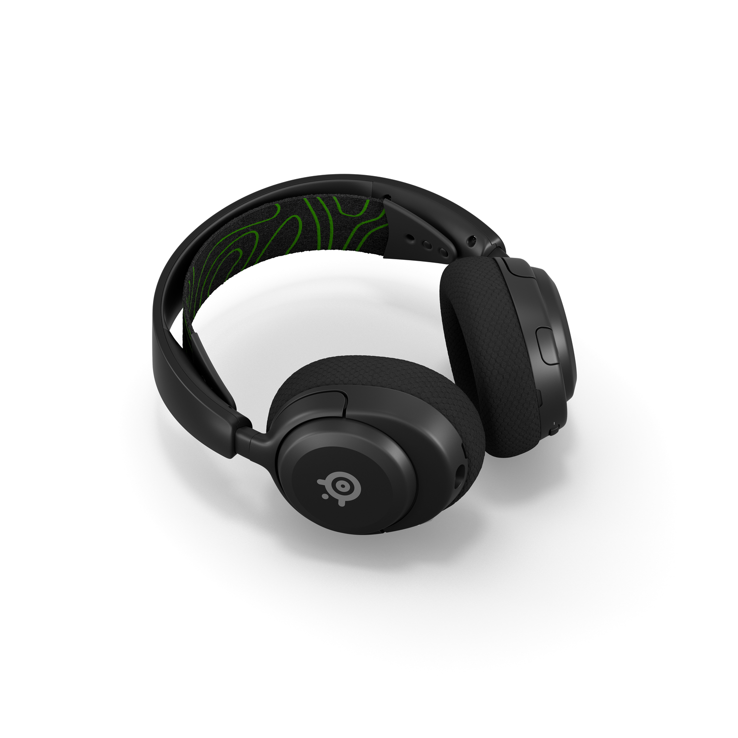Casque de jeu noir avec un motif vert sur le bandeau.