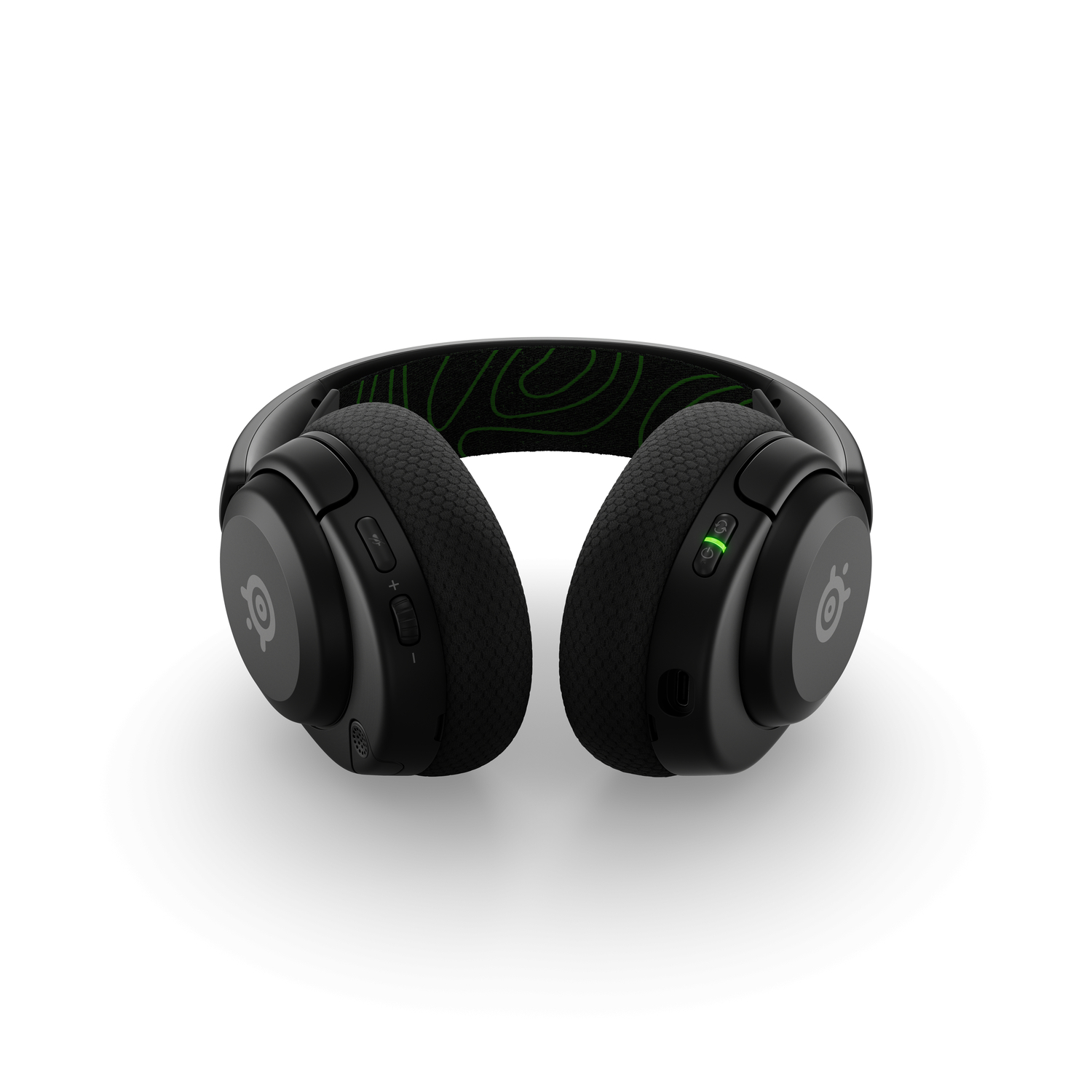 Casque SteelSeries noir, vue de dessus, avec des accents verts, sur fond blanc.