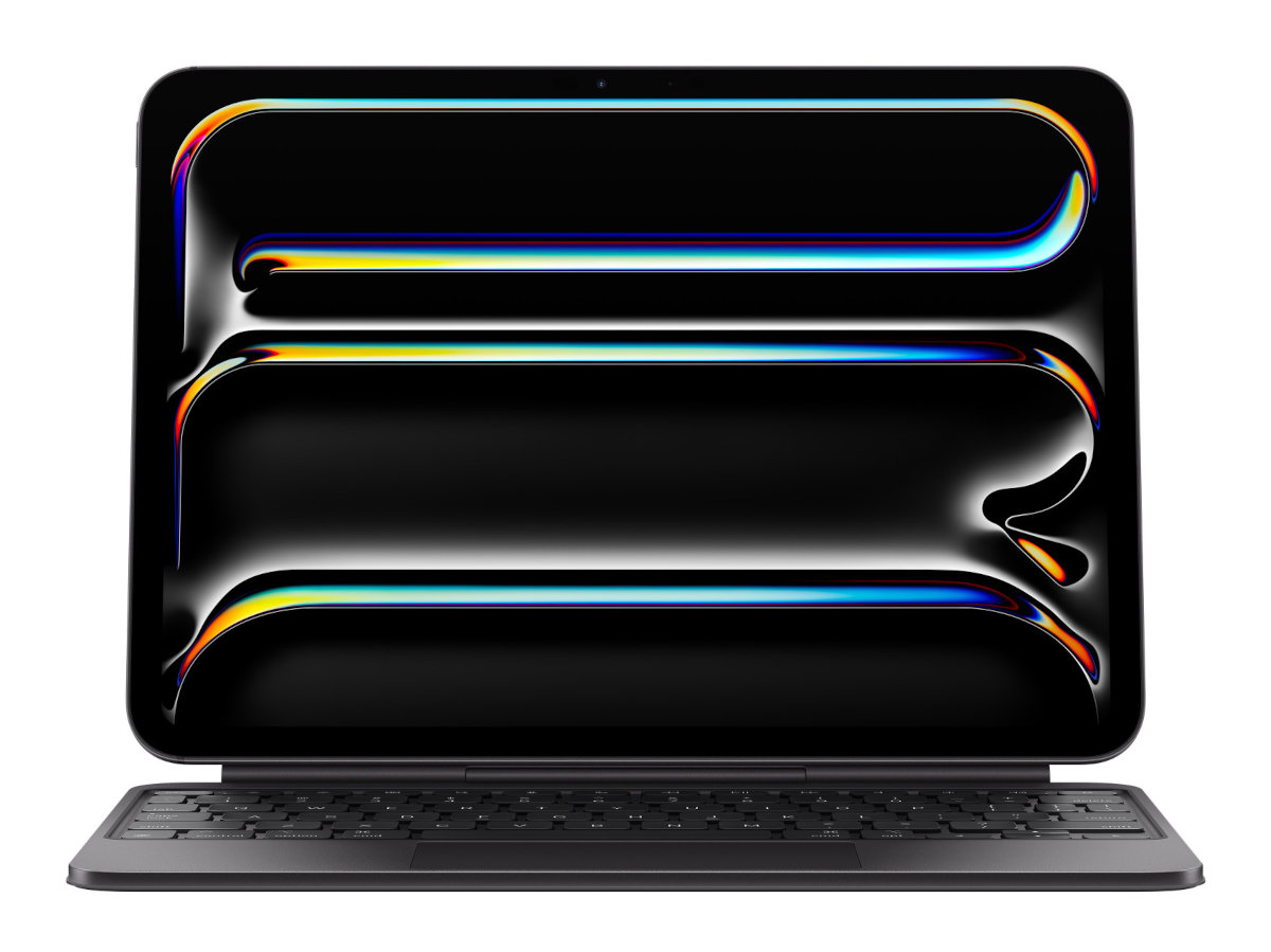 Tablet z klawiaturą. Ekran jest czarny, pokazuje kolorowy, świecący wzór.