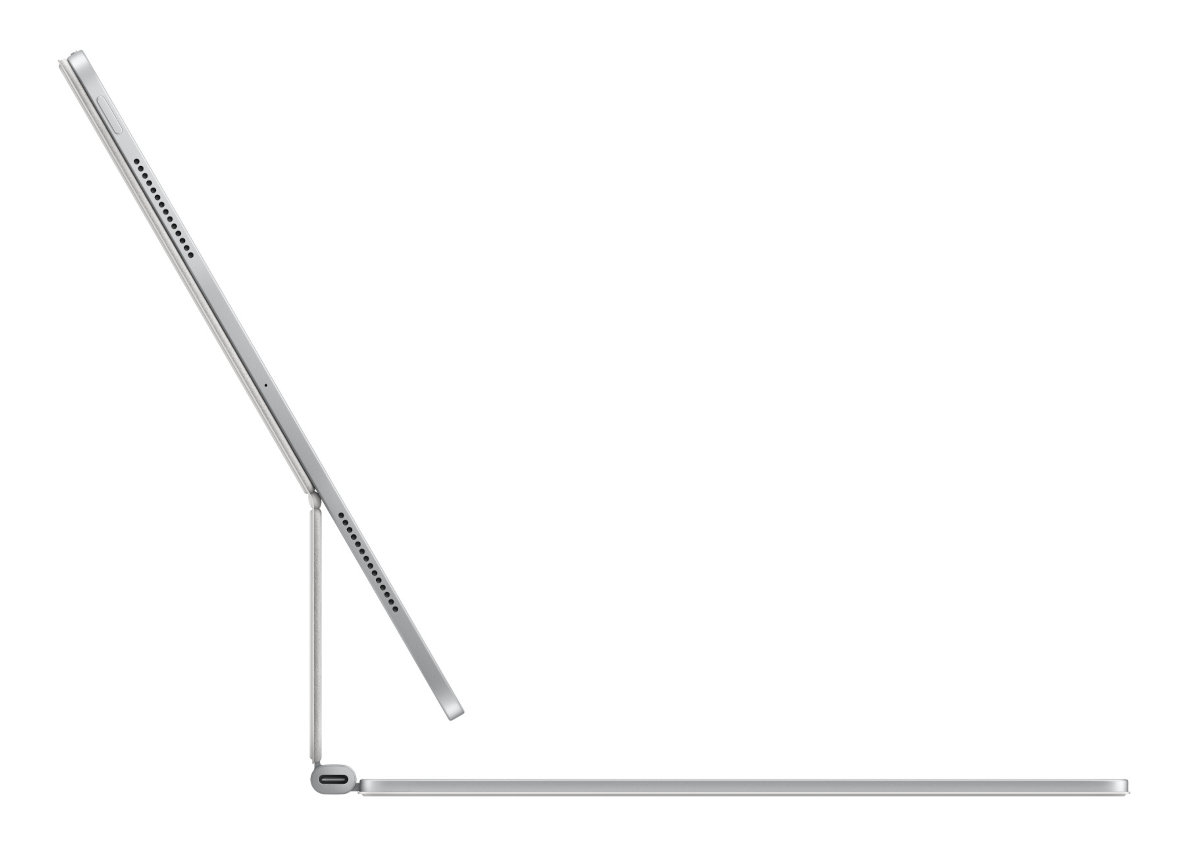 Srebrny tablet z podstawką klawiatury pod kątem. Tablet jest otwarty, pokazując port USB-C i głośniki.