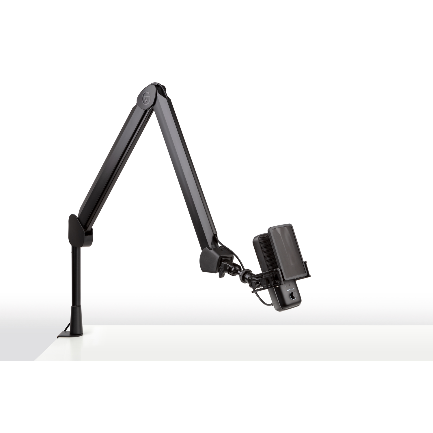 A black microphone and a black arm stand on a white surface, angled towards the right.