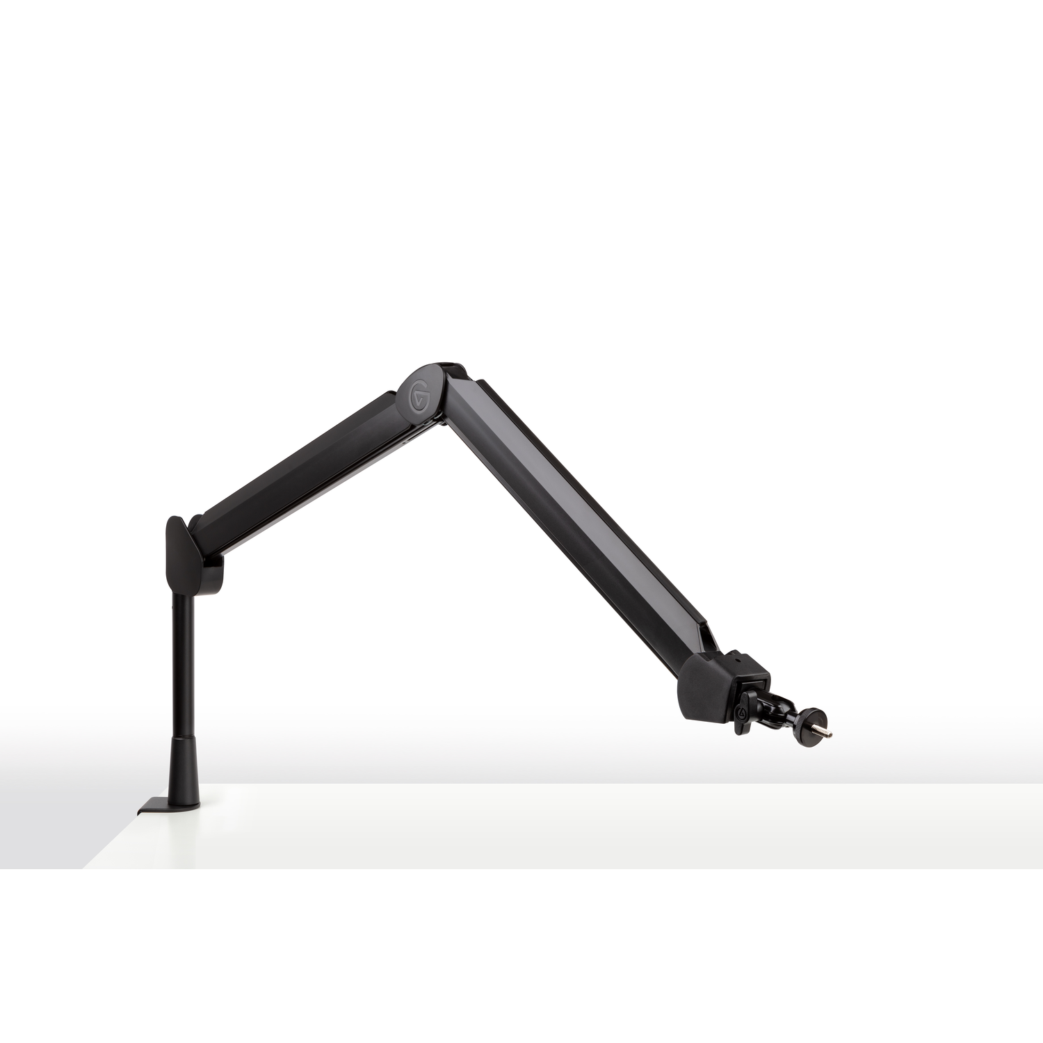 Black microphone arm, mounted on a desk. It is adjustable and has a jointed design.