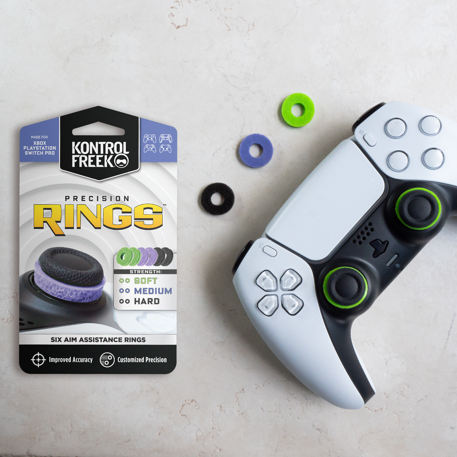 A gaming controller with rings, and a package with labels for precision rings.