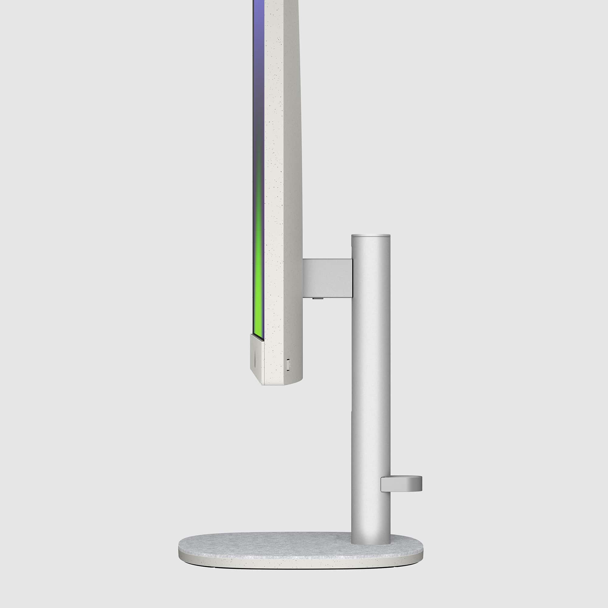 Una vista de perfil del monitor de la computadora con un soporte plateado y una pantalla colorida.