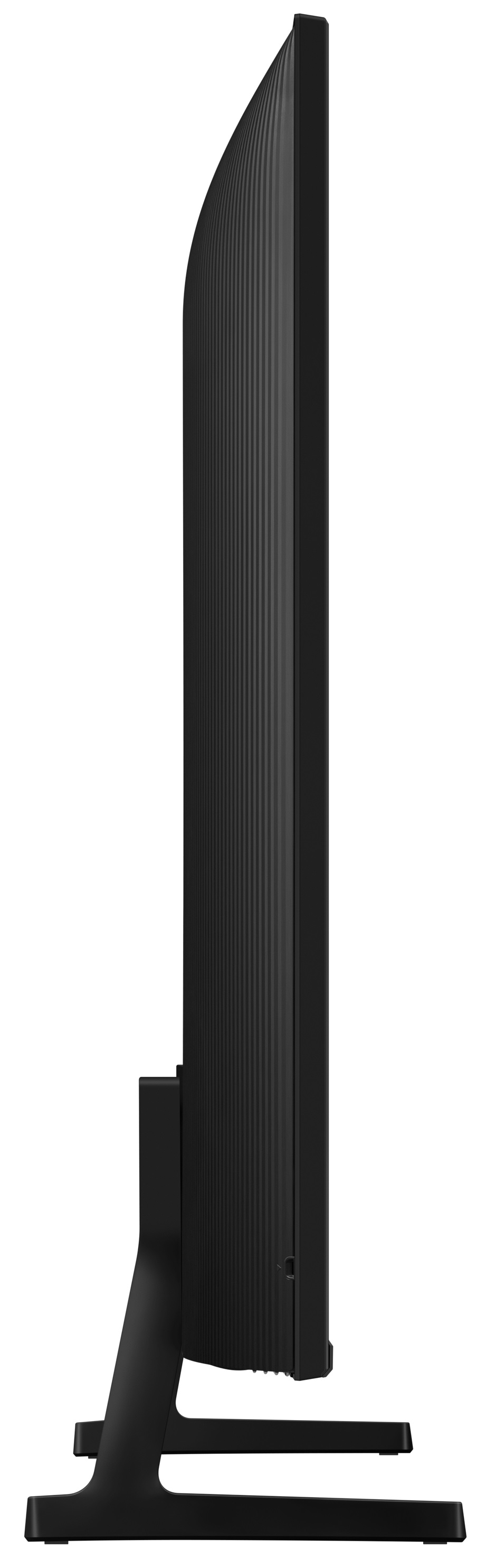 Widok z boku czarnego telewizora na podstawie. Ekran jest wyłączony, białe tło.