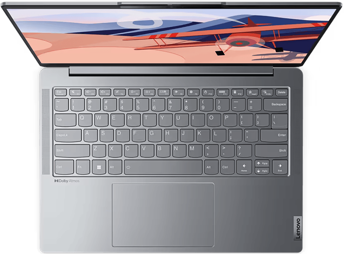Egy nyitott laptop, felülnézet, billentyűzettel és egy repülőgép illusztrációt mutató képernyővel.