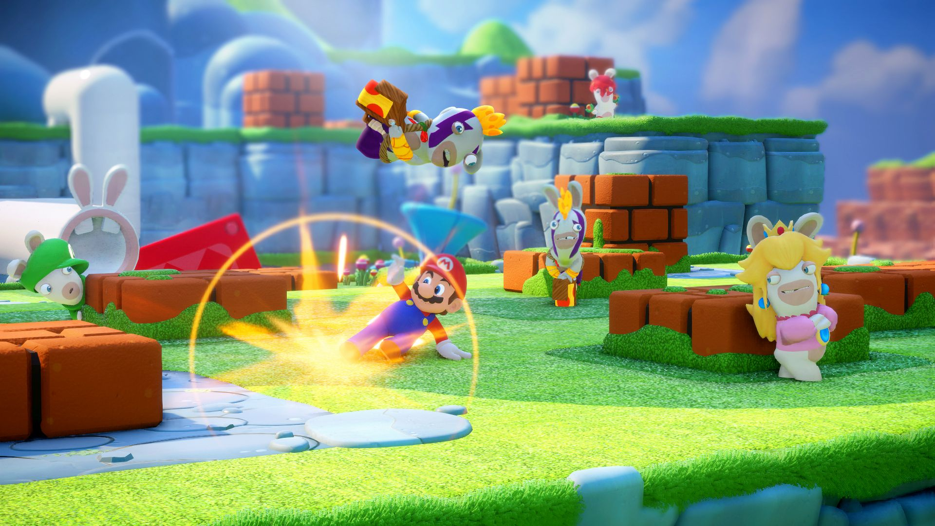 Mario in einem Spiel, mit Rabbids-Charakteren, in einer hellen, farbenfrohen Umgebung.
