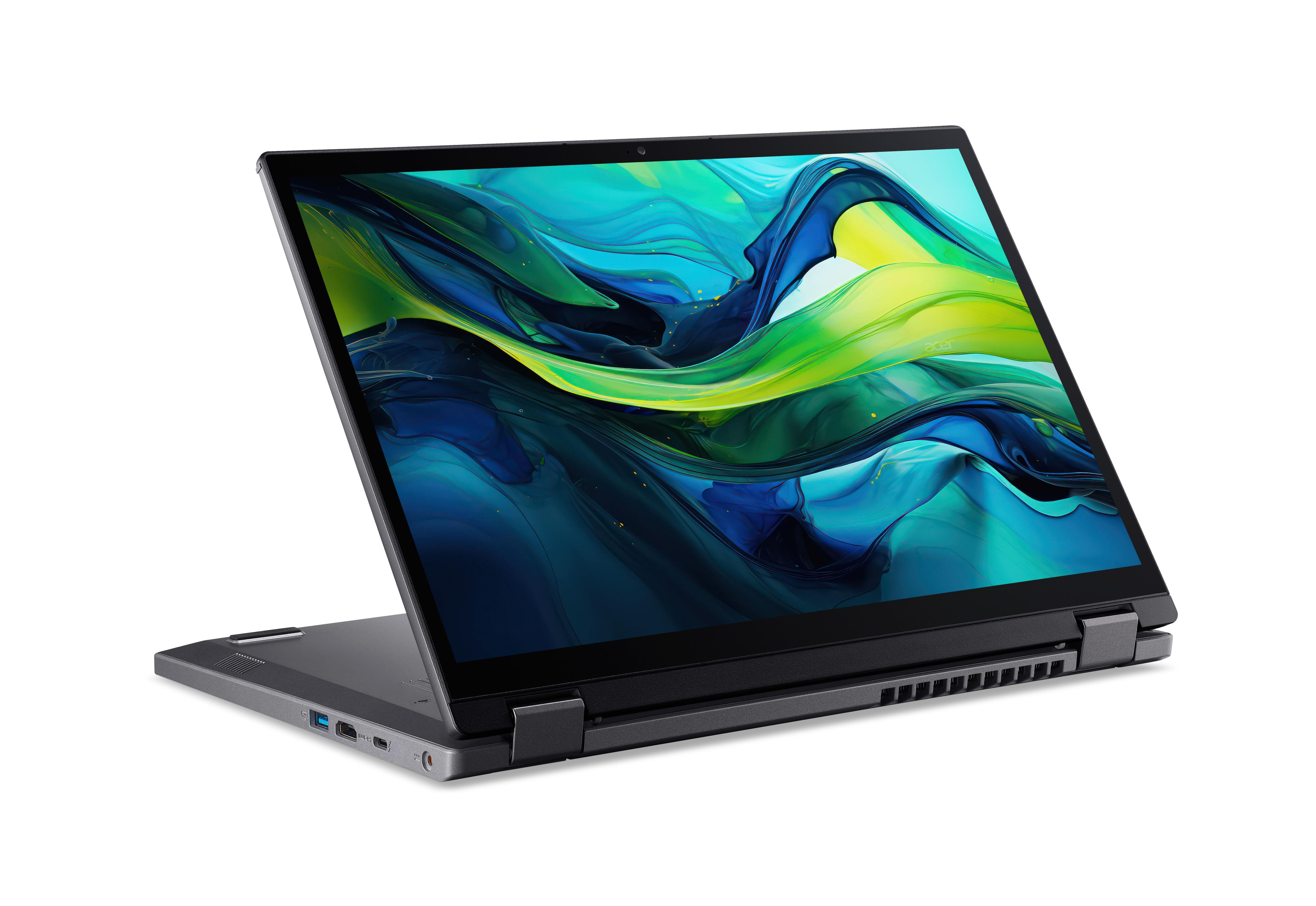 Laptop mit geöffnetem Bildschirm, der farbige abstrakte Formen zeigt. Grauer Rahmen, schwarze Tastatur. Weißer Hintergrund.
