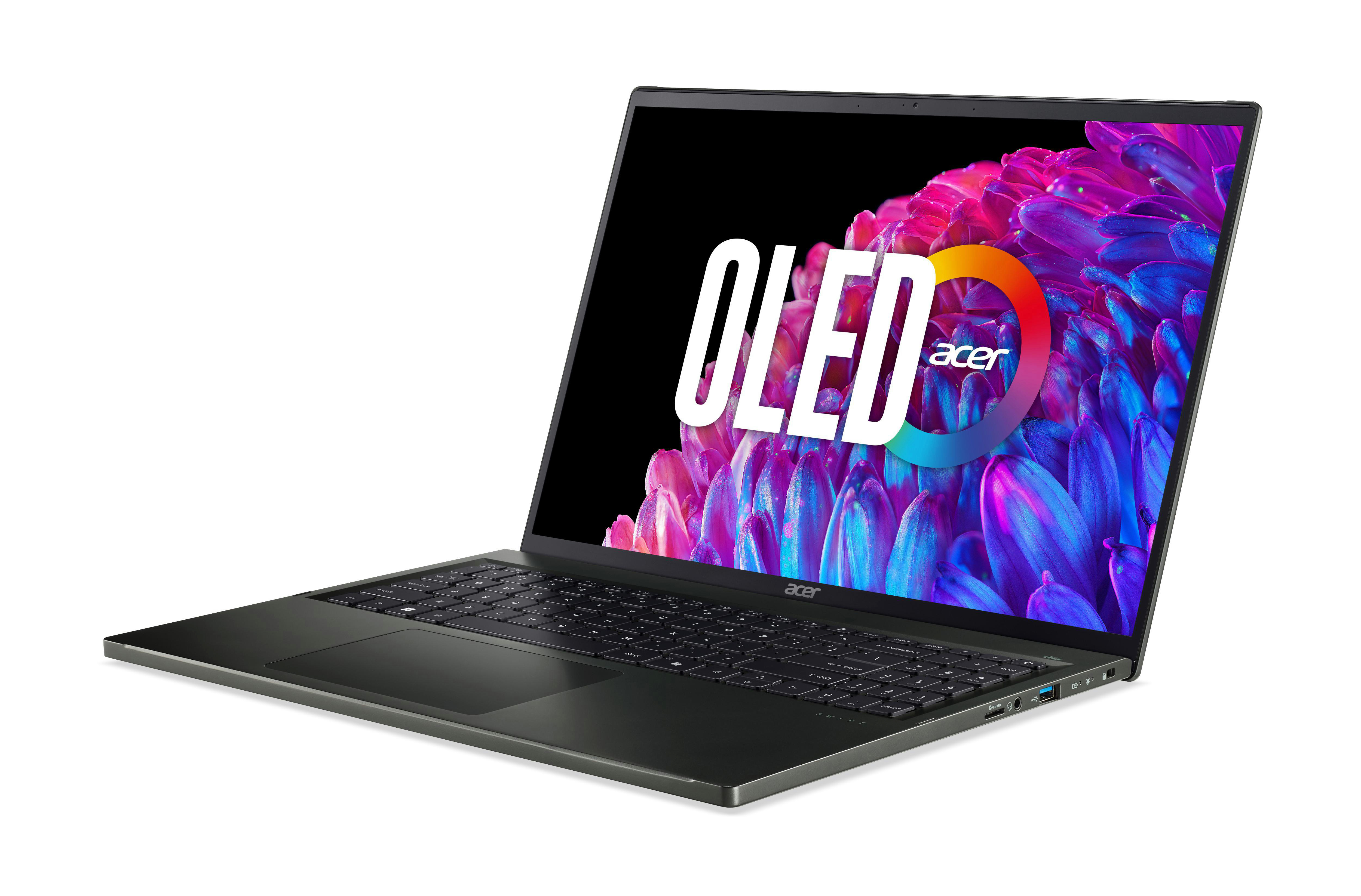 Laptop, schwarzes Gehäuse, offen. Bildschirm zeigt OLED-Logo. Auf Weiß isoliert.