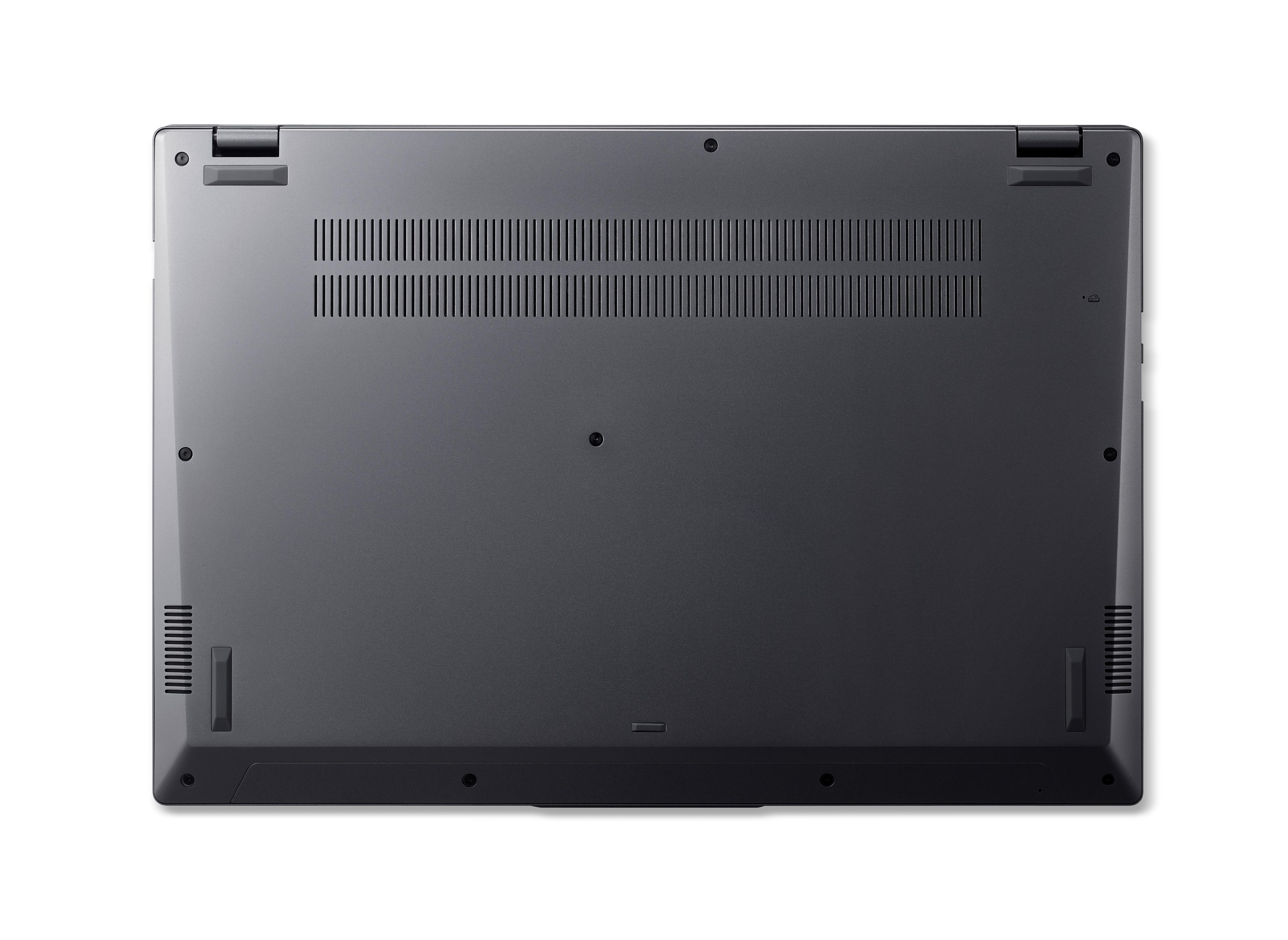 Die Unterseite eines dunkelgrauen Laptops mit Lüftungsschlitzen und Füßen.