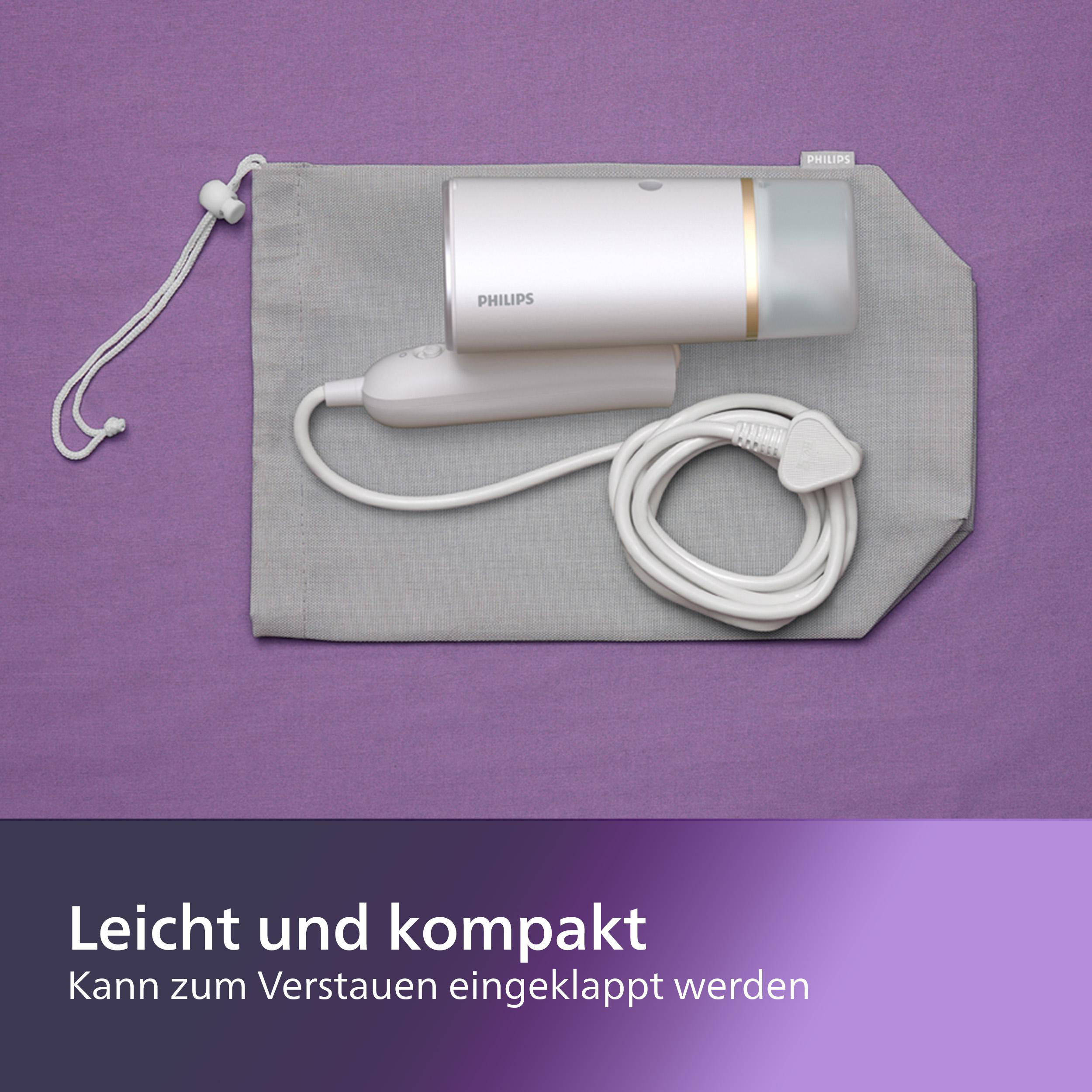 Ein weißes Haarentfernungsgerät und Ladegerät liegen auf einem grauen Beutel auf einer lila Oberfläche.