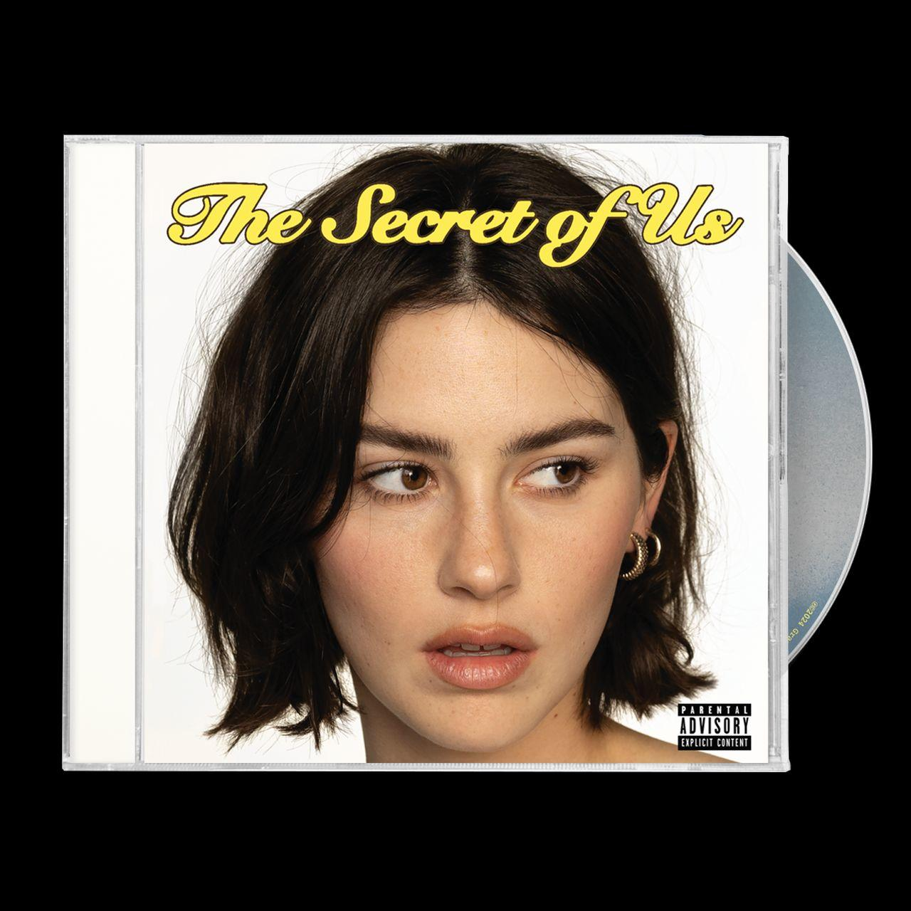 Albumcover mit dem Gesicht einer Frau und dem Titel "The Secret of Us". Eine CD ist teilweise sichtbar.