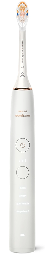 Egy fehér elektromos fogkefe. Van egy kefefej és gombok. A 'Philips Sonicare' felirat látható.