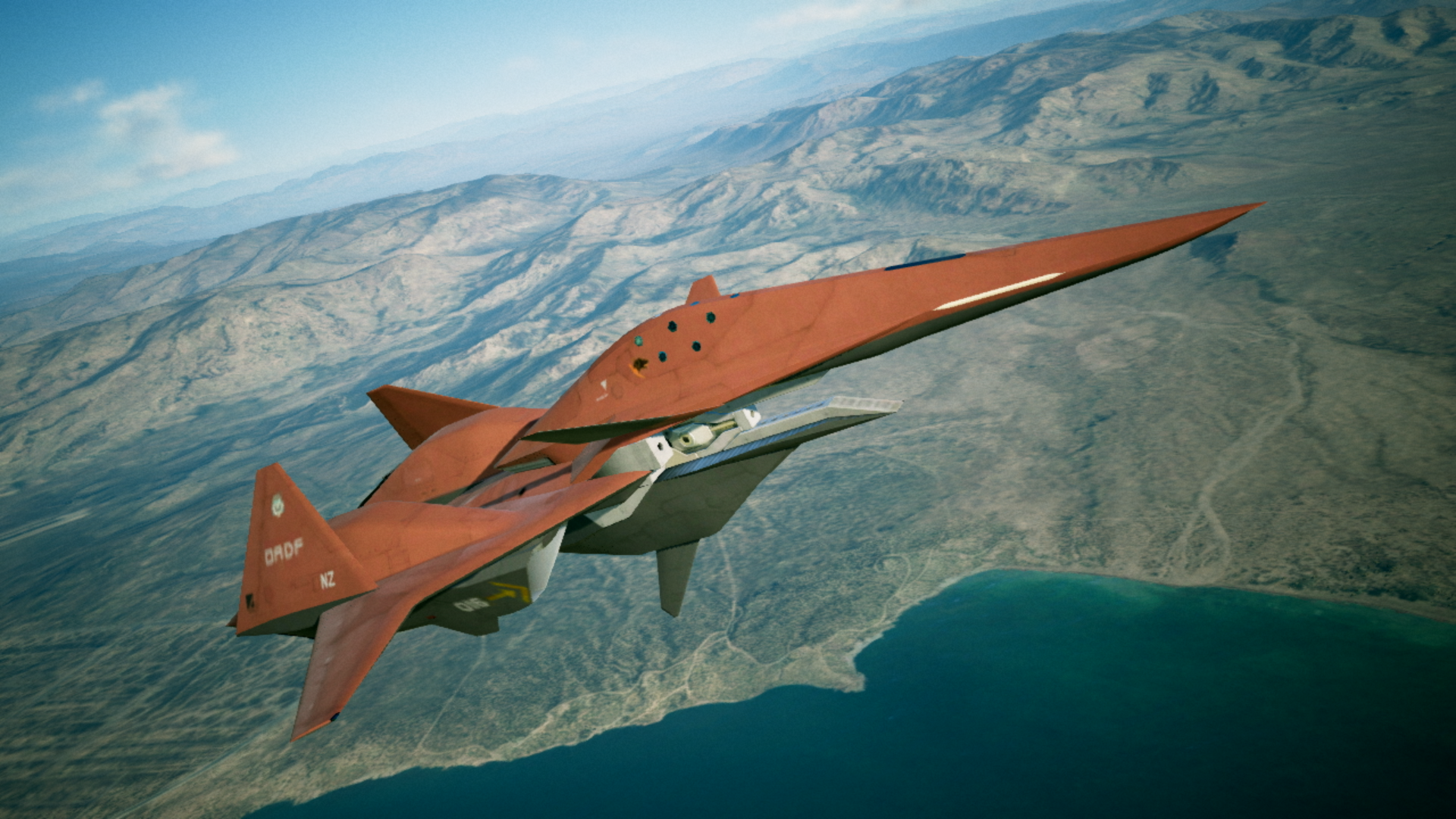 Aereo rosso che vola sopra acqua e terra. Parte inferiore bianca, corpo superiore rosso e cielo blu.