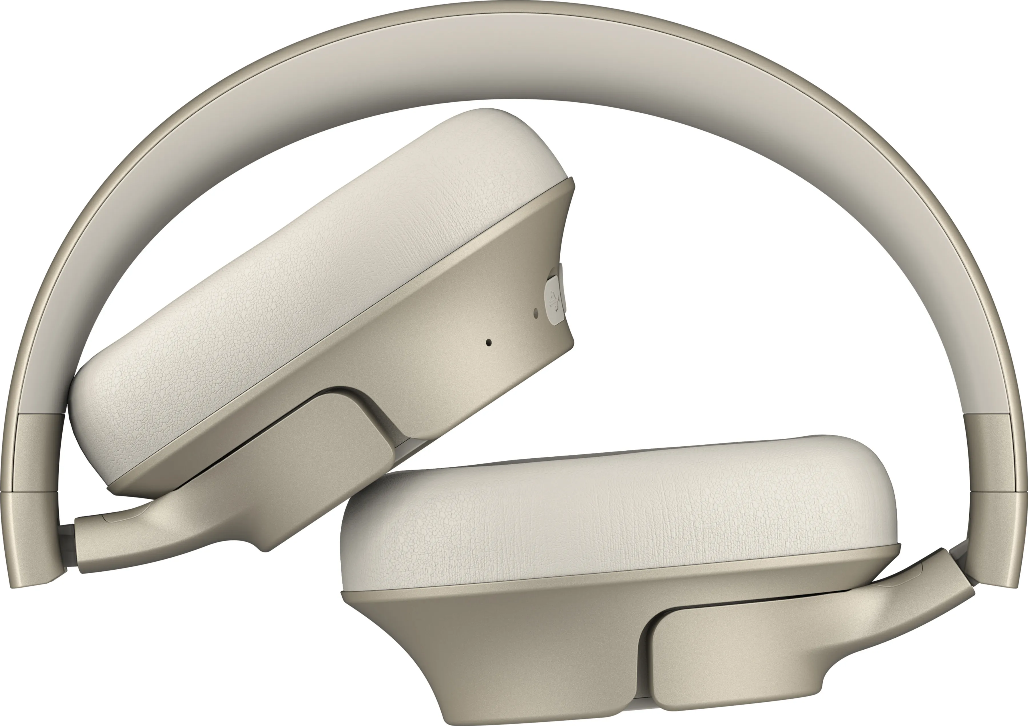 Casque audio doré et crème plié. Les écouteurs sont crème et inclinés.